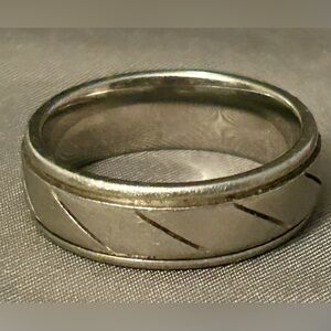 men's tungsten carbide wedding band with a diagonal cut design.